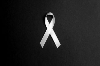 Image of a white ribbon symbolizing of anti-violence against women