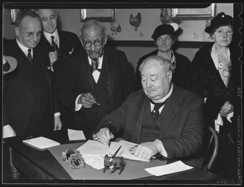 William Hubbard and Sir Henry Pellat signing guest register