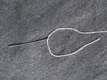 A threaded needle