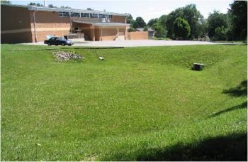 A large empty grassy area above ground