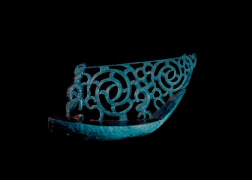Tauihu artifact against black background
