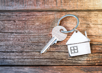 key sitting on wooden table