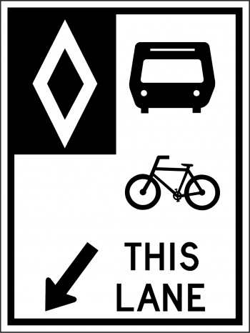 Black and white street sign indicated that only buses and bikes are allowed in the lane.