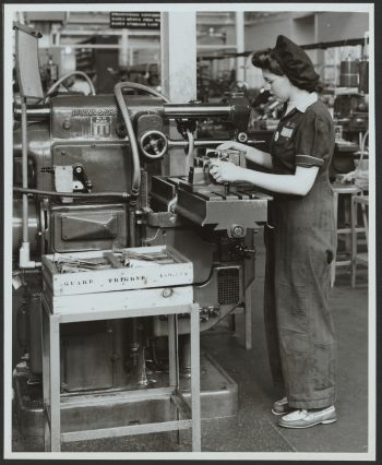 Female worker at lathe in armaments factory