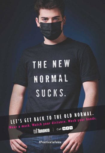 Young man wearing a t-shirt that state the new normal sucks