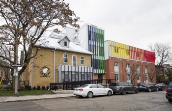 Side buidlign view with rainbow siding