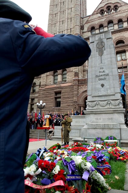 A veteran salutes the Old City Hall Cenotaph