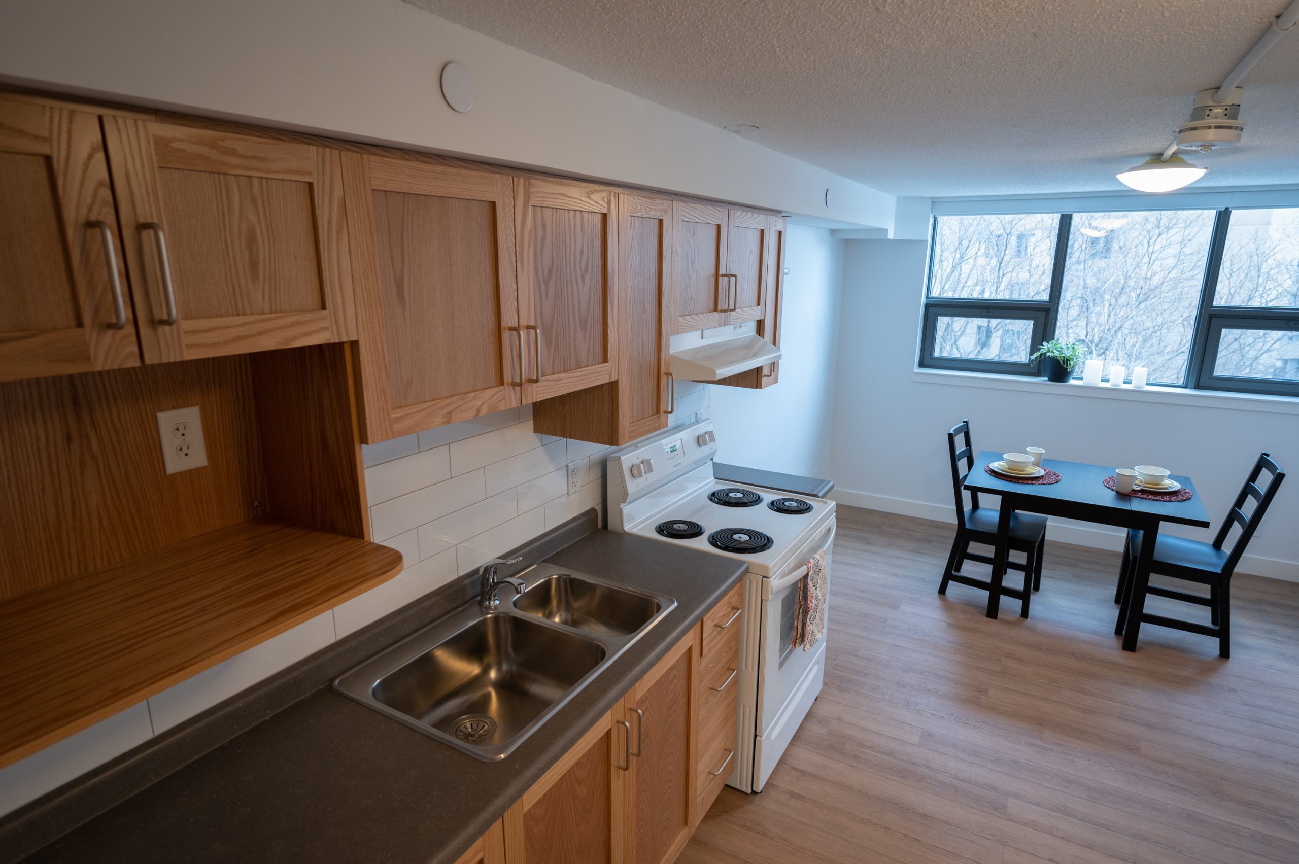 Kitchen with stove and sink in 389 Church St. unit