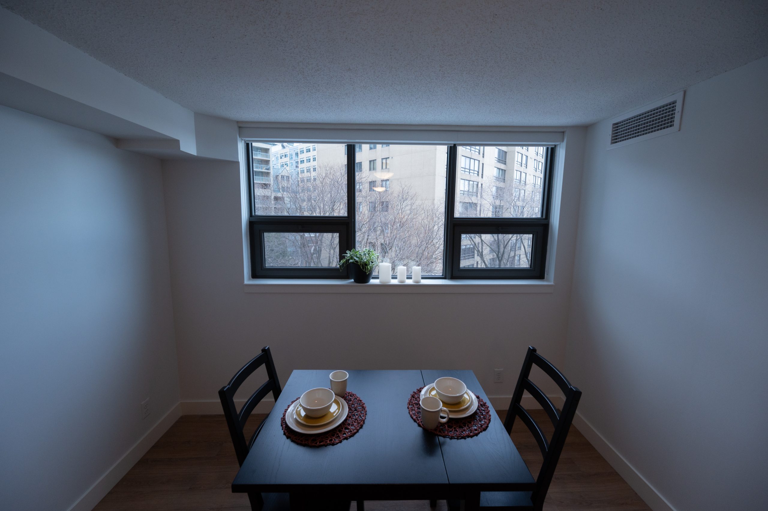 Dining table and window in unit of 389 Church St.