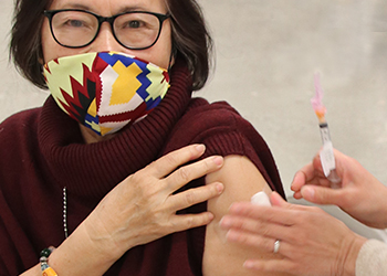 woman receiving a vaccination