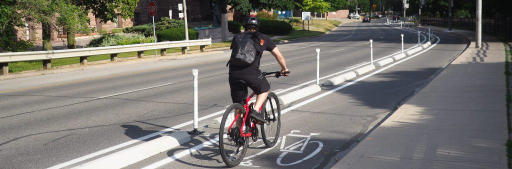 image of a man on the University Cycle tracks that show 2 lanes of traffic.