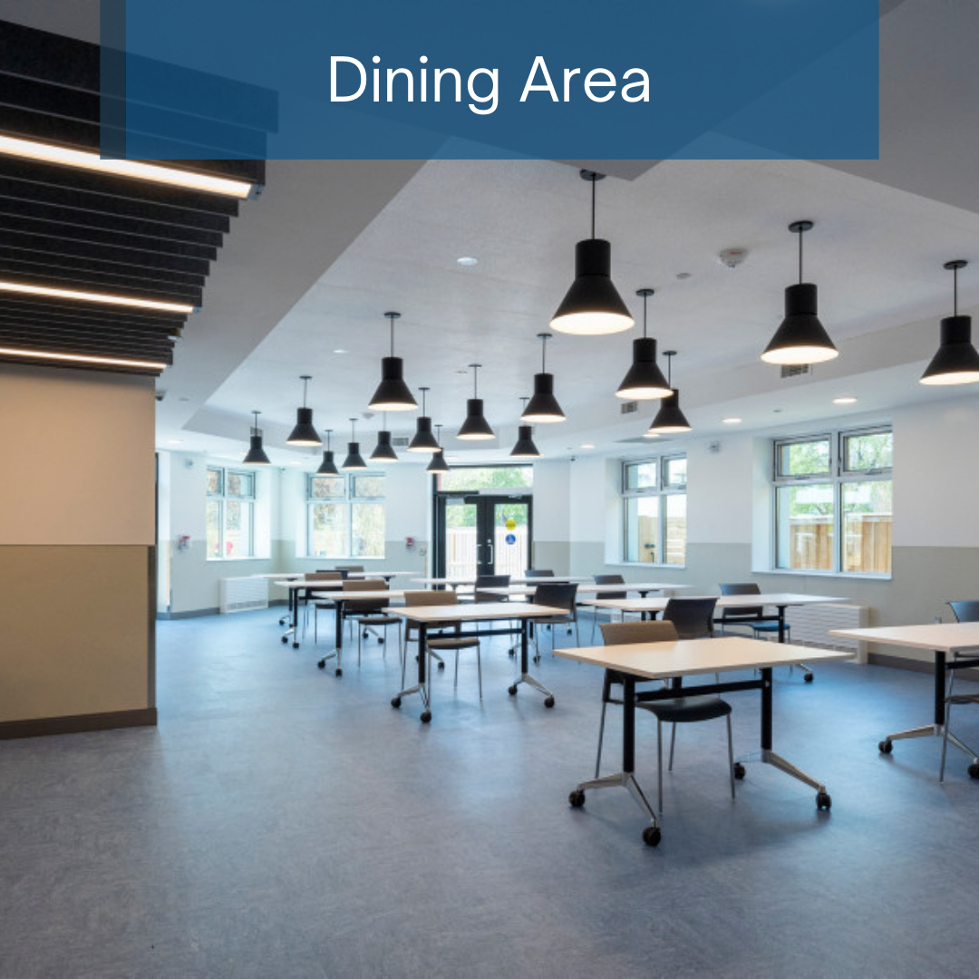 mobile desks and overhead lamps placed in the dining area corner of the shelter