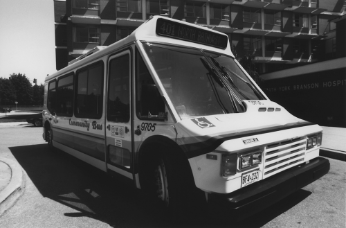 A bus with "community bus" painted on the side.