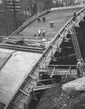 Men working on installation of bridge supports.