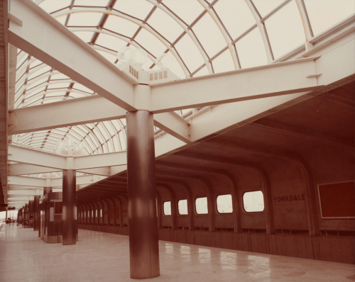 Looking along platform showing pillars and glass domed roof