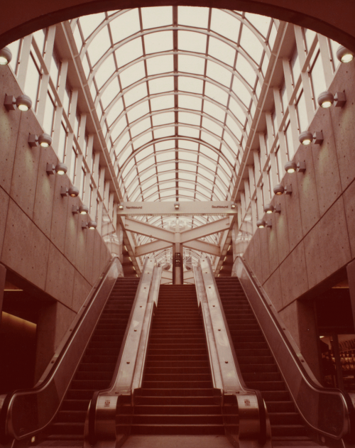 Looking up from mezzanine to platform area showing glass domed roof of station