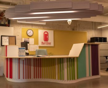 reception desk with colourful walls