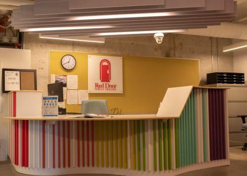 reception desk with colourful walls