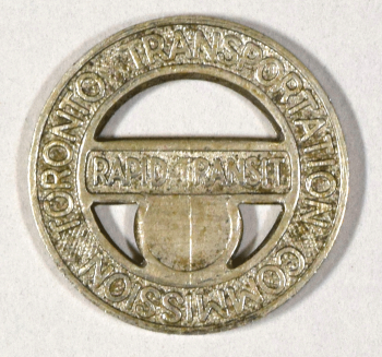 Photograph of a metal Toronto Transit Commission token