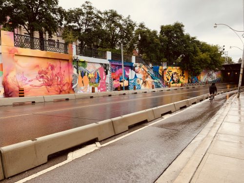 colourful painted murals on the concrete wall of the Lansdowne Underpass