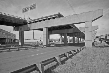 Concrete expressway on pillars ends suddenly as though cut off.