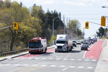 Bus using RapidTO bus lane at traffic light. 