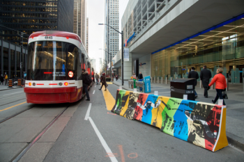 People boarding/alighting a streetcar on King Street