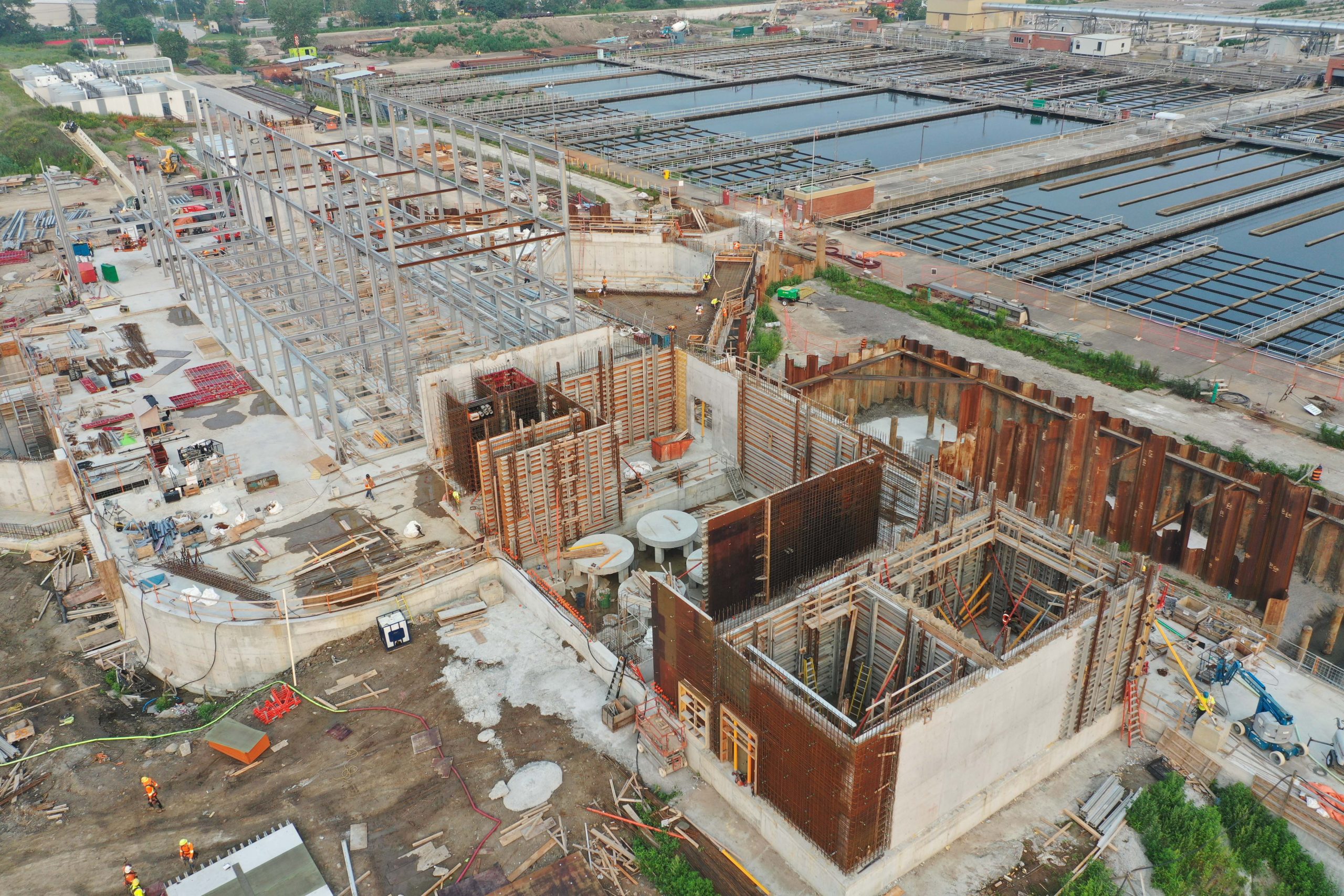 Ashbridges Bay Treatment Plant UV Disinfection project. New chemical building in foreground, UV Disinfection building in background July 2021