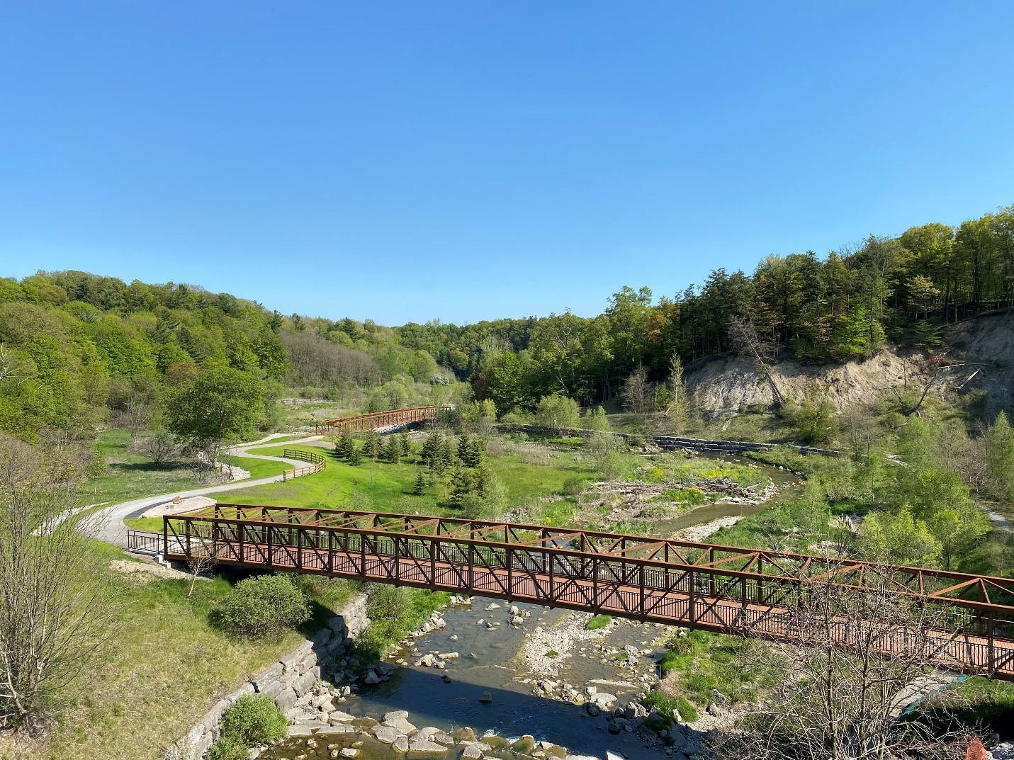 Newly installed pedestrian bridges, rest area and trail connection in Morningside Park south of Ellesmere Road.