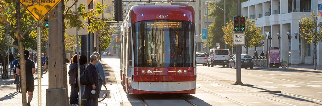 Streetcar travels along Queens Quay.