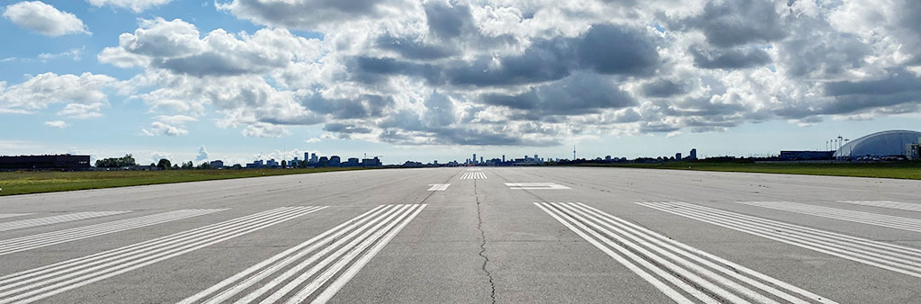 Downsview runway looking South on a partly cloudy day.