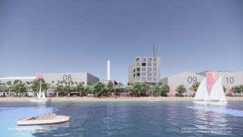 Artist rendering of Basin Media Hub visible from waterfront. Five large studio buildings lining the shore, with trees and sailboats in the foreground.