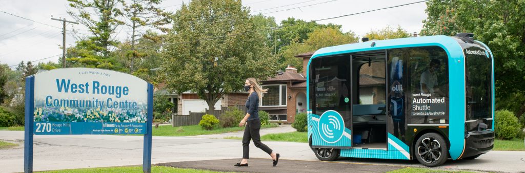 West Rouge Automated Shuttle at a stop in front of West Rouge Community Centre. A passenger is disembarking.