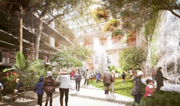 Artist rendering of the park view of the Wellington Destructor site, a 0.85 hectare City-owned property that includes a 3,700 square metre heritage building showing an open concept meeting space. In the foreground are people interacting with the bright, green space.