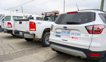 Photo of City of Toronto vehicles displaying a poppy decal on the rear of the vehicle