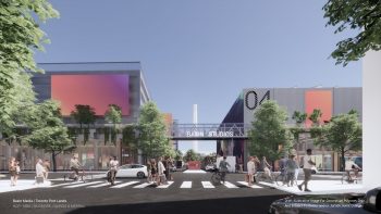 Artist rendering of Basin Media Hub visible from street level. Two large buildings connected by a pedestrian bridge, people walking and trees lining the street.