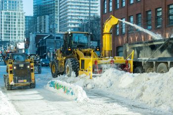 extra large snow blower moves snow