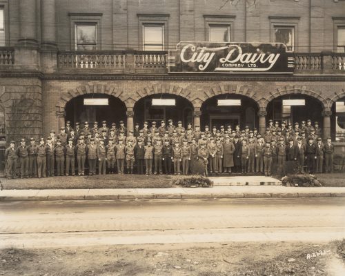Photograph of City Dairy deliverymen outside of Spadina Crescent