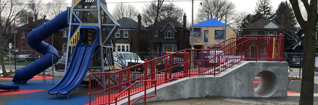 New playground at Trace Manes Park. Image shows large climbing structure in the background, with the new sand play area in the foreground.