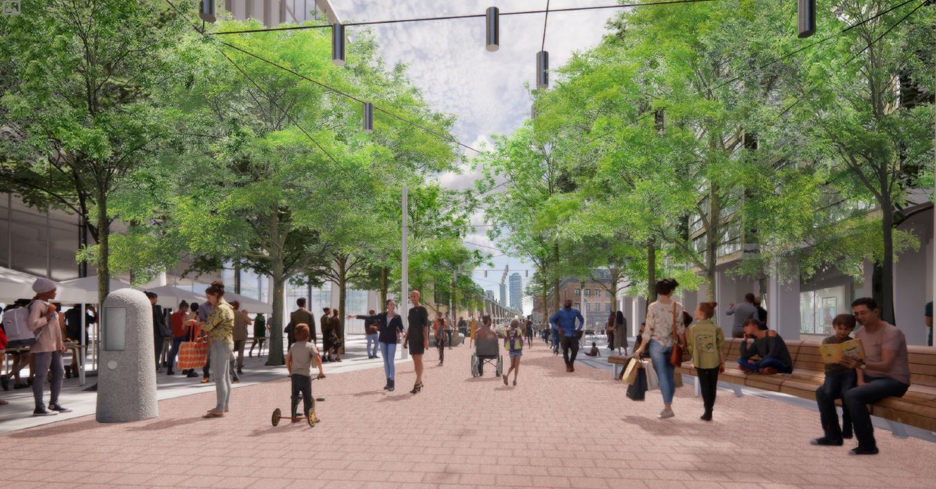 Perspective rendering of the Preferred Design, looking south towards King Street. Pictured in the rendering are various park users strolling down the central promenade, sitting on bench seating, and participating in a community event on the east side. Tree canopy and catenary lighting is also shown.
