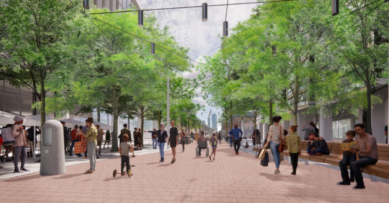 Perspective rendering of the Design, looking south towards King Street. Pictured in the rendering are various park users strolling down the central promenade, sitting on bench seating, and participating in a community event on the east side. Tree canopy and catenary lighting is also shown.