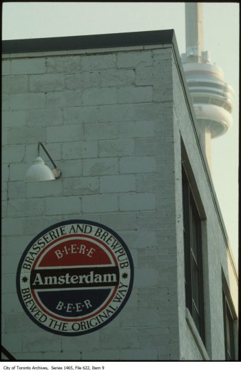 Photograph of Amsterdam Beer sign on exterior of brewery building.
