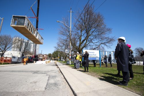 Mayor Tory, Deputy Mayor Bailao, Councillor Bradford, and MP Nathaniel Erskine-Smith observe the craning of modules into place at 540 Cedarvale Ave.