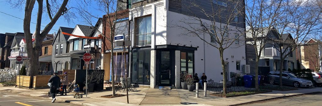 An example of a cafe in a neighbourhood land use designation area on a corner lot.