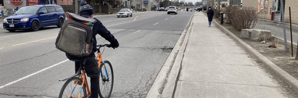 Person riding a bike on Victoria Park Avenue