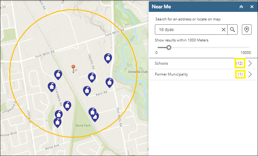 Display of the Near Me menu, with Address of 18 Dyas, North York in the Search box and the map shown with a circle and several schools shown inside of the circle