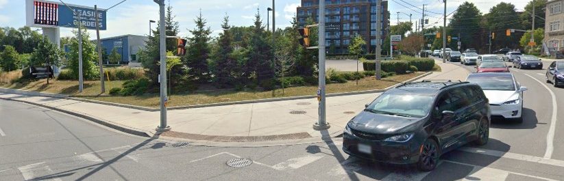 Right turn channel removal at Millwood Rd and Laird Dr