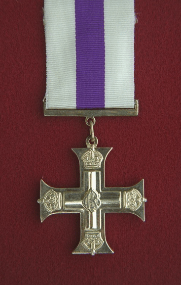 Photo of the Military Cross medal on ribbon