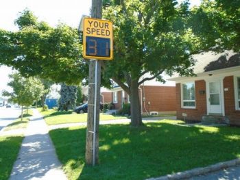 Image of a mobile watch you speed display sign attached to a pole