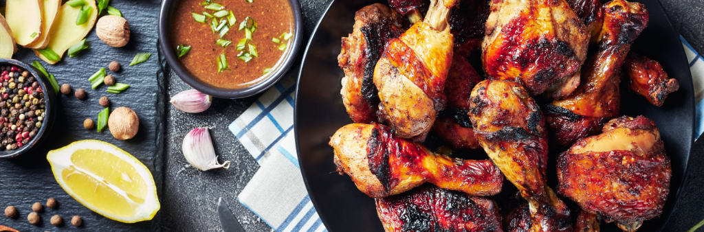 Table spread featuring jerk chicken